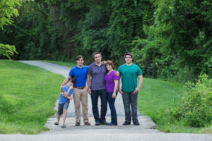 Family of five with three sons outdoors at a park